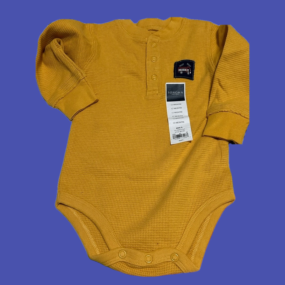 Brand new gold waffle knit onesie. Size 12 months.